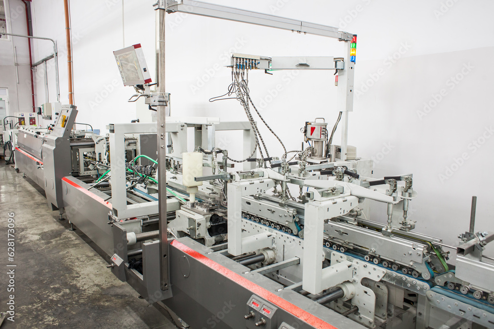 The equipment for a press. Offset machine at the printing manufacturing. Printing machine