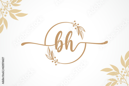 luxury gold signature initial bh logo design isolated leaf and flower