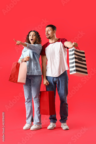 Surprised young couple with...