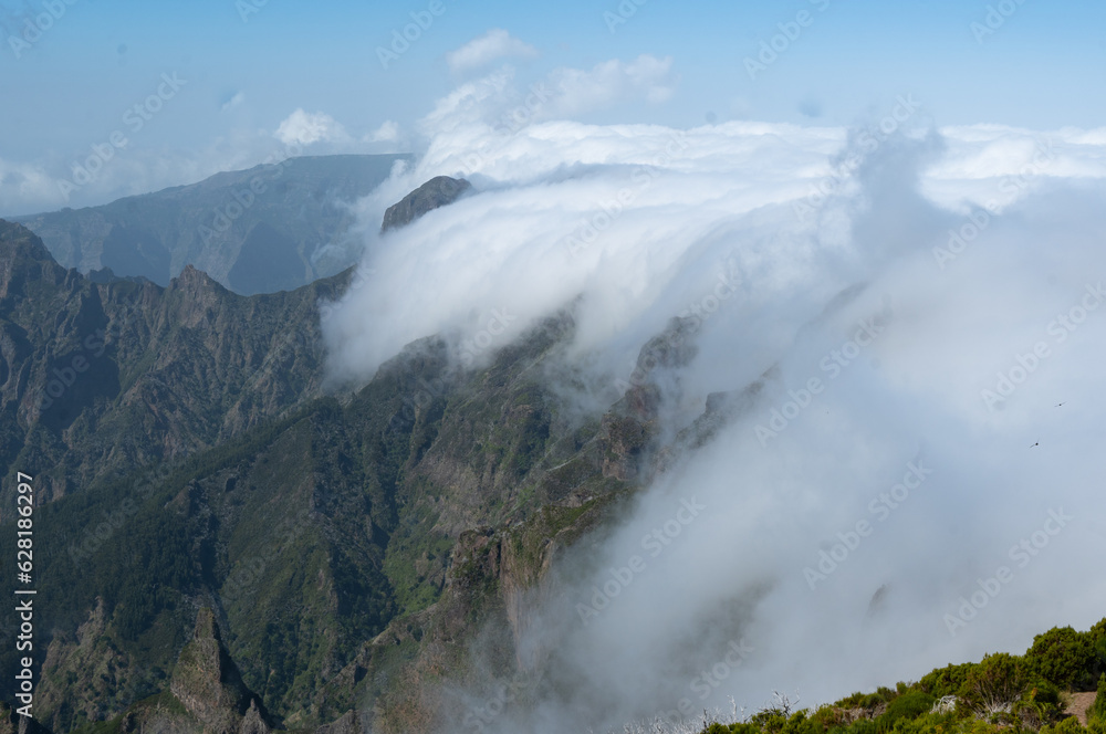 Aerial drone view over the foggy mist on the mountain tops of Madeira