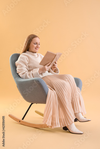 Young woman reading book in...