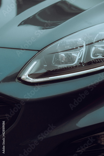Close-up photo of a car headlight © Adam Rhodes
