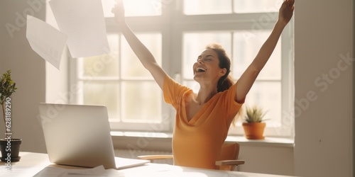  Home Office Delight, Smiling Attractive Woman Embracing Summer Vibes, Sitting Next to Laptop with Excitement and Joyful Eyes, Engaging in Playful Use of Paper Amidst Lively Facial Expressions