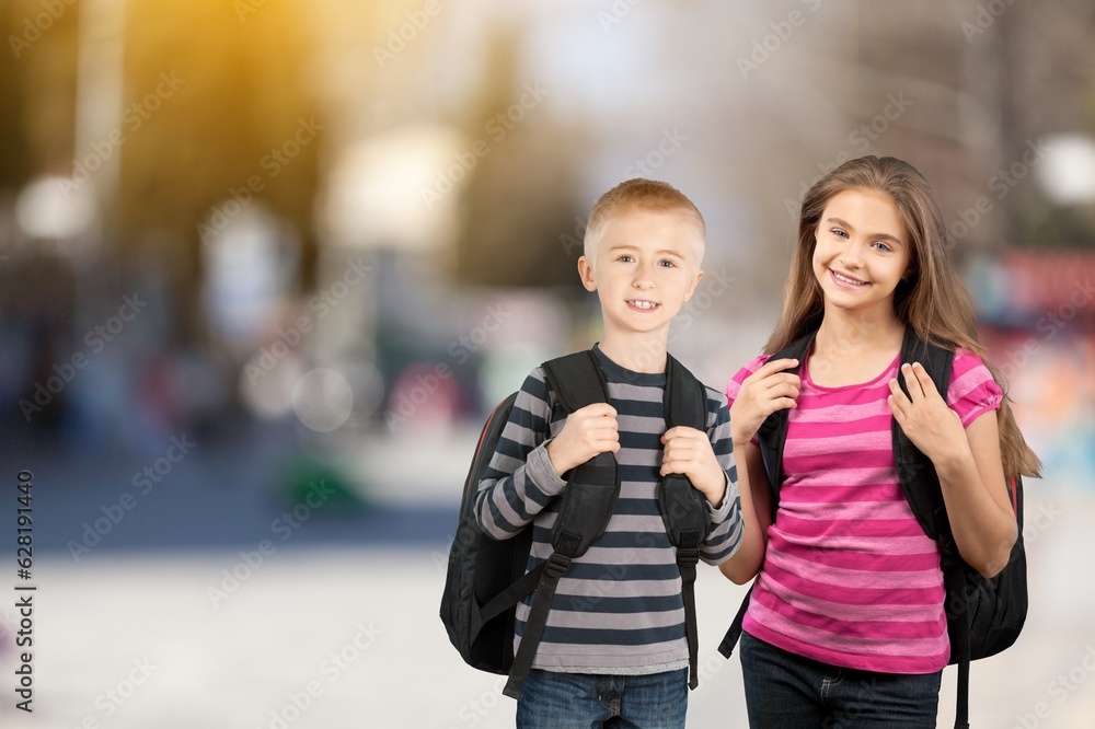 Two teenage happy young student friends going to school.