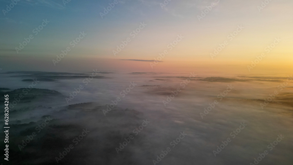 Beautiful, peaceful, drone captured foggy sunrise over North Alabama 