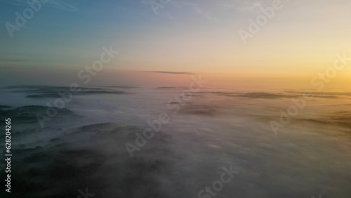 Beautiful, peaceful, drone captured foggy sunrise over North Alabama 