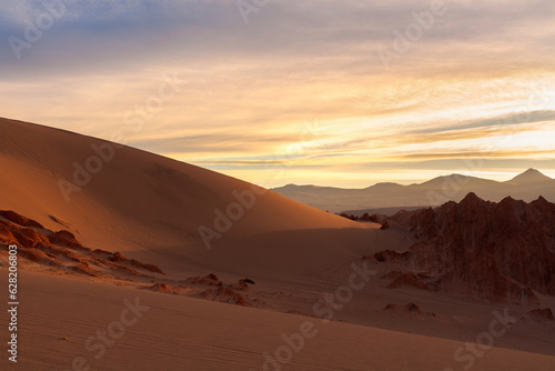 Sunrise illuminating the salt formations and sand dunes at Valle de la Muerte near San Pedro de Atacama in the Atacama desert, Chile
