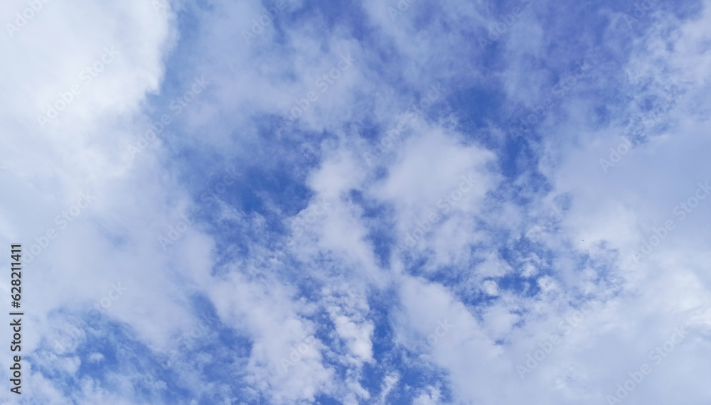 Obraz premium blue sky background with white clouds during day .Abstract white cloud and blue sky in sunny day texture background,Light cloudy texture. Sunny day concept. Vector illustration,