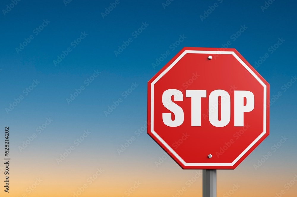 A red alarm stop sign at blue sky background