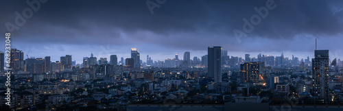 Panorama of the city of Bangkok in Thailand before the storm in the twilight , rainy season thick clouds cover the city, global warming concept