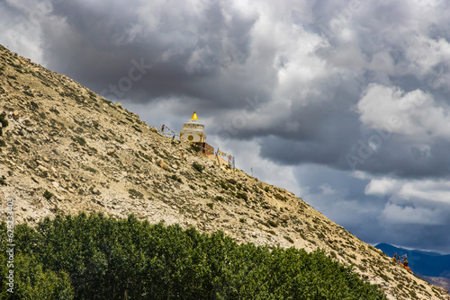 Desert Mountainous Landscape of Chosar Valley in Lo Manthang, Upper Mustang of Nepal photo