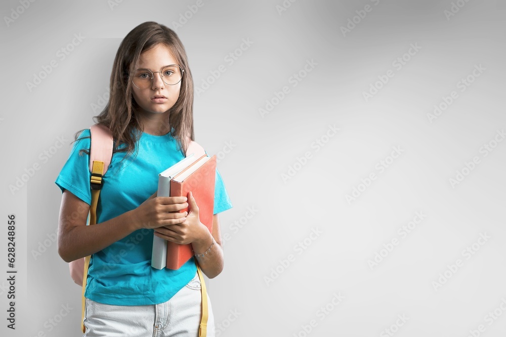 adorable happy student holding books for study adorable happy student holding books for study