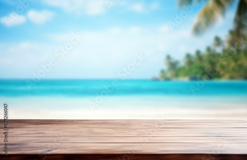 Wooden table top on blur tropical beach background - can be used for display or montage your products. High quality photo