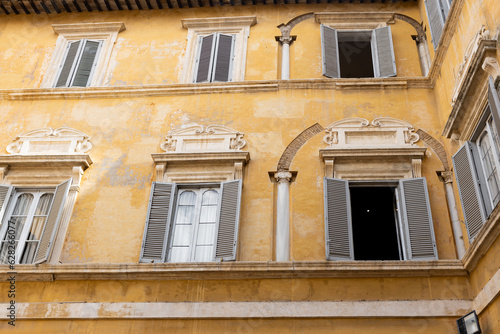 Architecture of Rome. A building with the characteristic facade and windows. Summer time