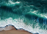 Aerial view of the waves crashing on the beach. Shot from a drone. High quality photo