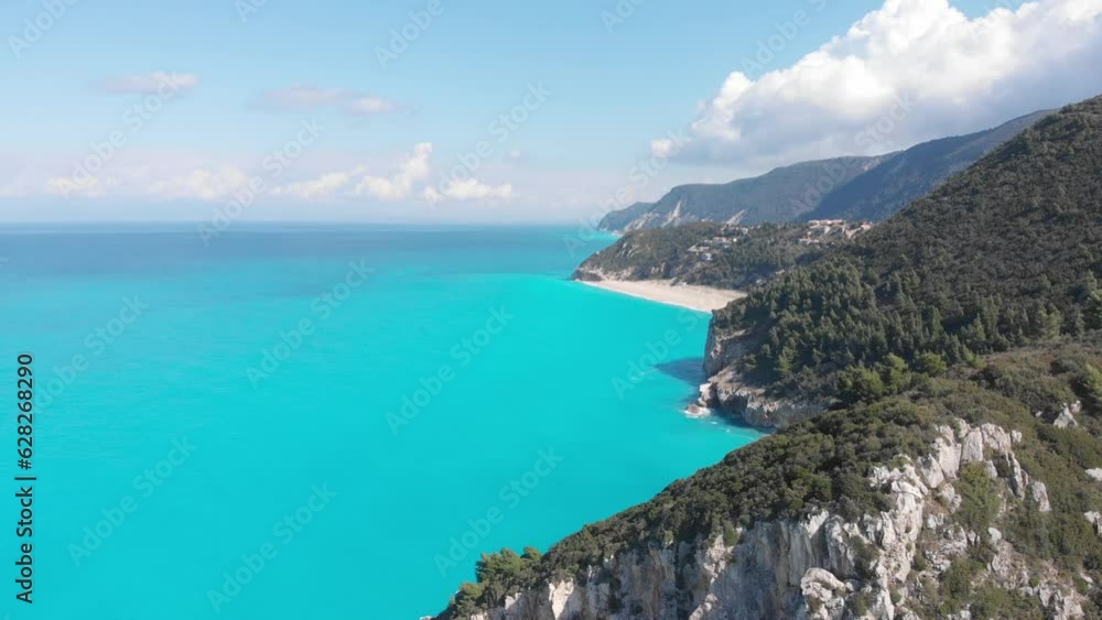 Aerial beautiful beach and water bay in the greek spectacular coast line. Turquoise blue transparent water, unique rocky cliffs, Greece summer top travel destination Lefkada island Aerial beautiful beach and water bay in the greek spectacular coast line. Turquoise blue transparent water, unique rocky cliffs, Greece summer top travel destination Lefkada island