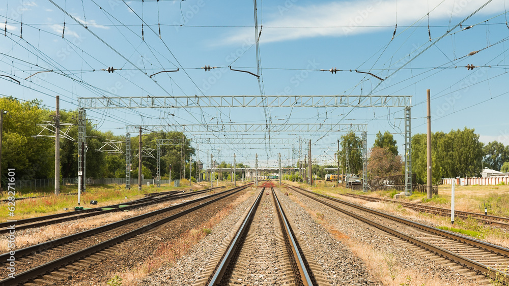 railway, in the photo rails against the background of a blue sky and clouds railway, in the photo rails against the background of a blue sky and clouds