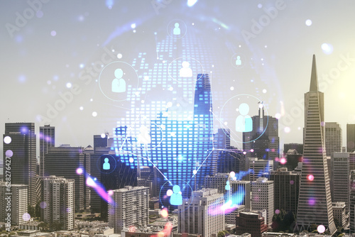 Virtual social network media hologram and world map on San Francisco cityscape background. Double exposure