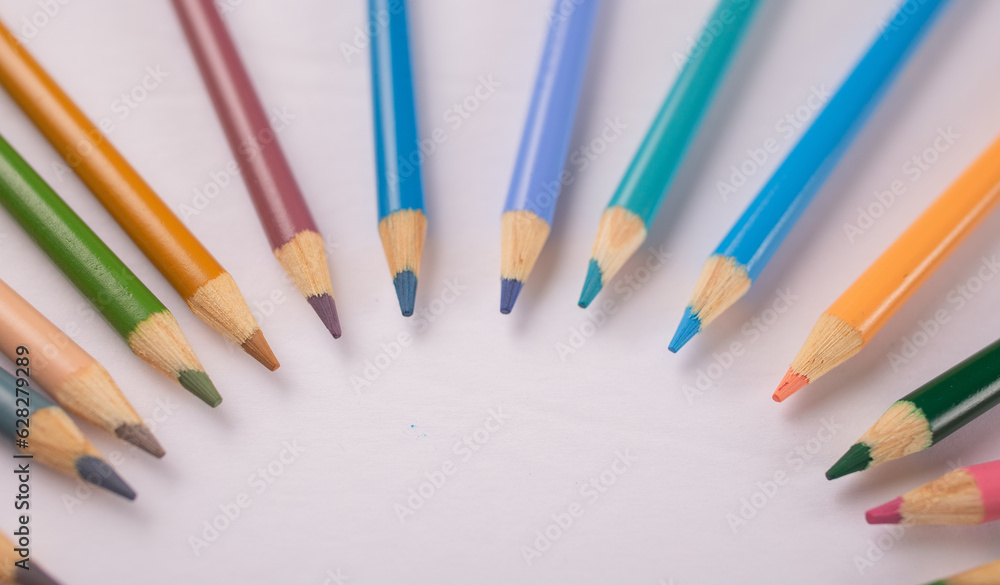 colored pencils in a circular design artwork 