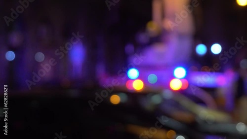 Defocus bokeh of rescue workers with police and ambulance lights. photo