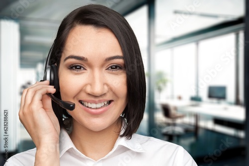 Smiling woman working with headset in modern office, AI generated image
