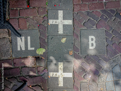 Baarle-Nassau, White cross on the floor, The border between Belgium and Netherlands, The most complicated border in Europe, Bits of Belgium in the Netherlands (some buildings straddle both countries) photo