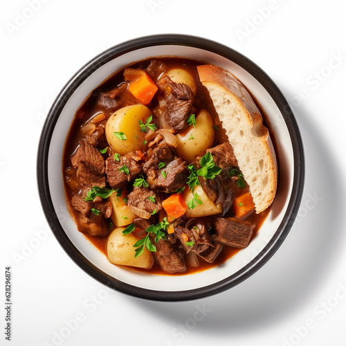 Top-down view of a bowl of beef stew isolated on a white background