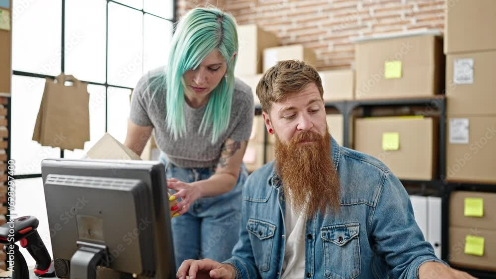 Man and woman ecommerce business workers scanning package with smartphone at office Man and woman ecommerce business workers scanning package with smartphone at office