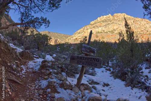 A sign marking the junction of the Dripping Springs Trail and the Boucher Trail at Grand Canyon Arizona. photo