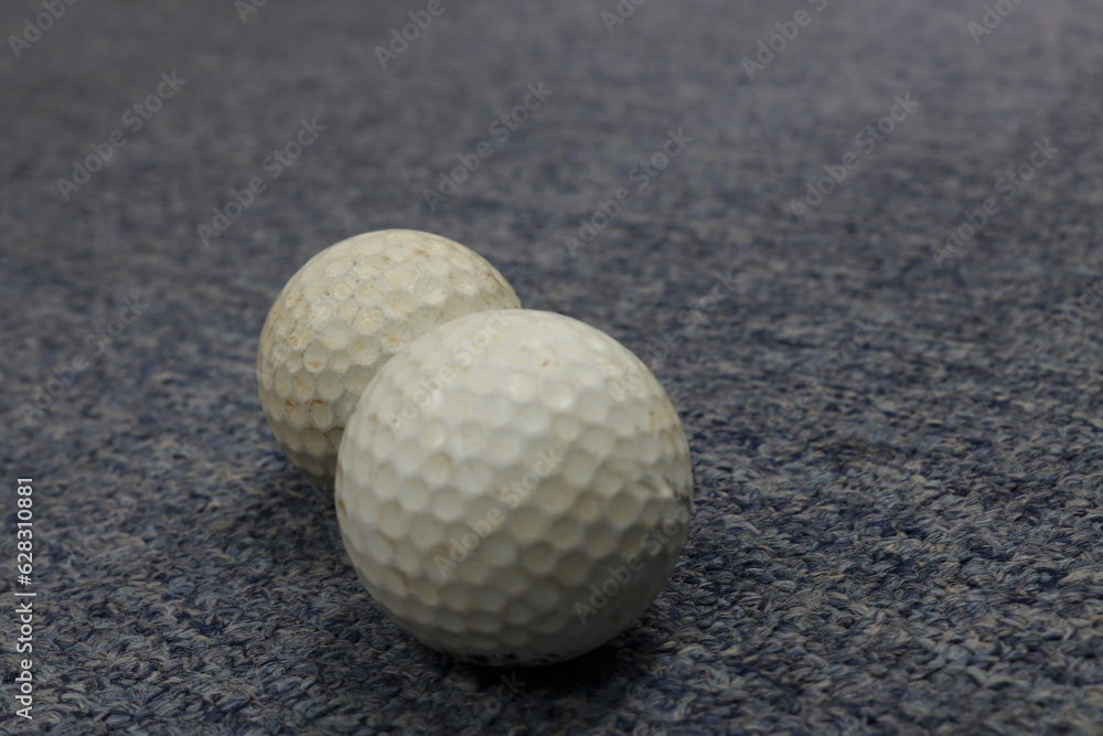 Photo of a white golf ball on the practice field Photo of a white golf ball on the practice field