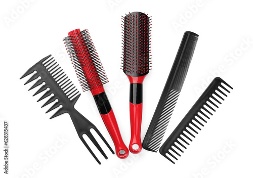 Set of hair brushes and combs isolated on white, top view