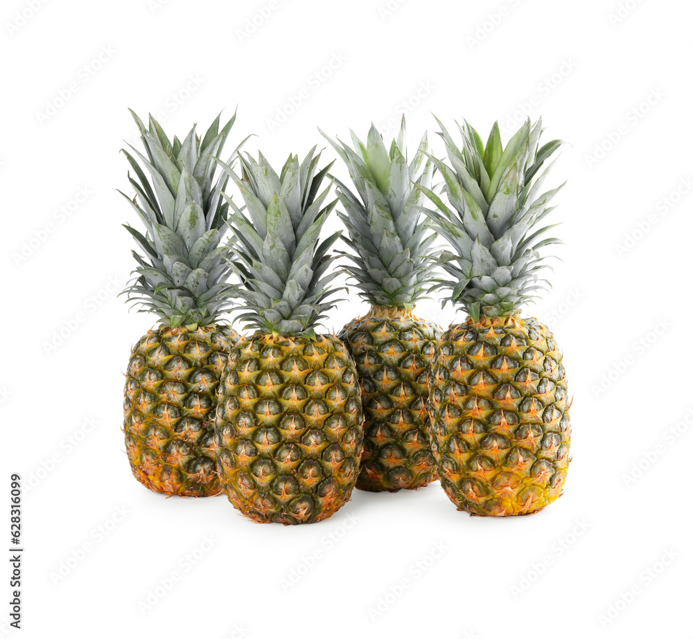 Many delicious ripe pineapples on white background Many delicious ripe pineapples on white background