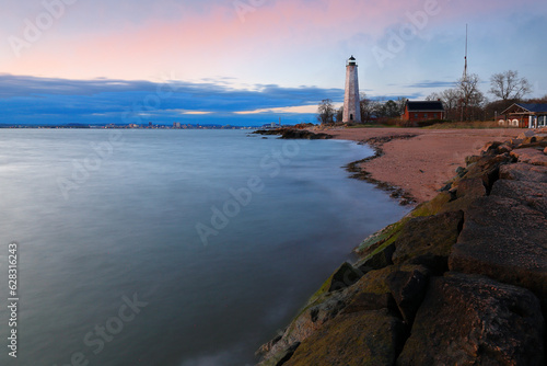 Beautiful sunset of New Haven Light House, Connecticut, USA. The lighthouse is dark, but the tower remains, greeting ships from around the world to New Haven. 