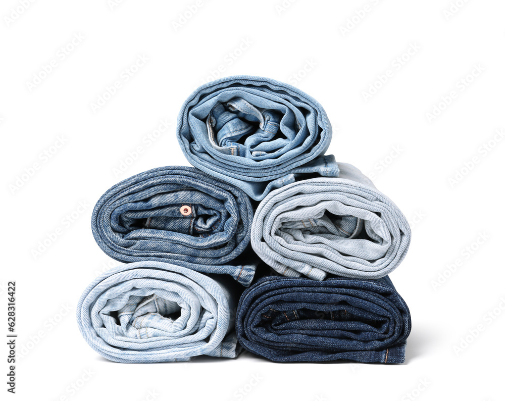 Different stylish rolled jeans isolated on white