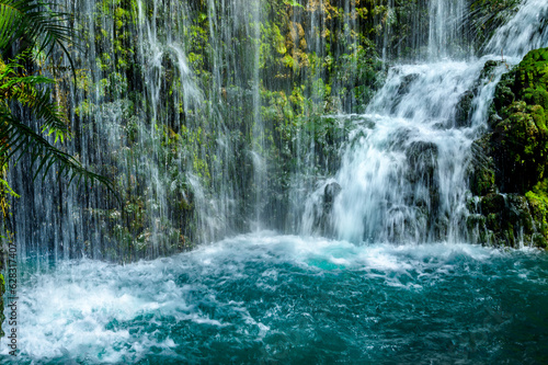 Waterfalls and green water in the pond at Chiang Mai province