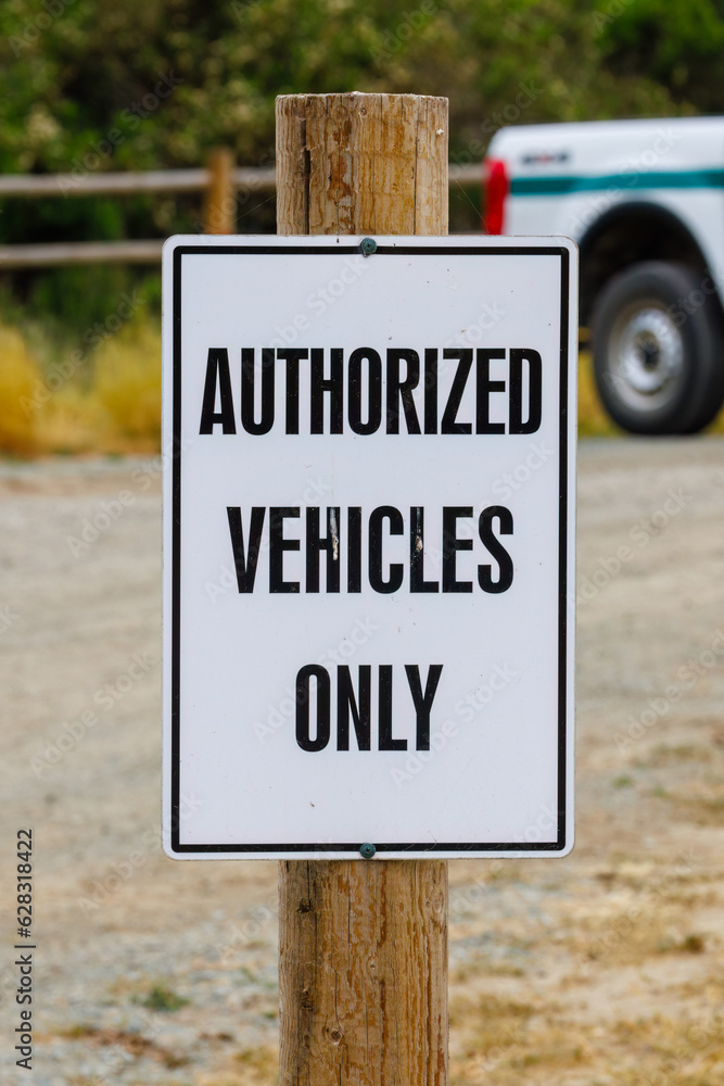 Authorized Vehicles Only sign on a wooden post
Authorized Vehicles Only sign on a wooden post
