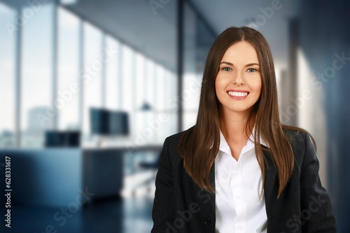 Happy young business woman employee posing