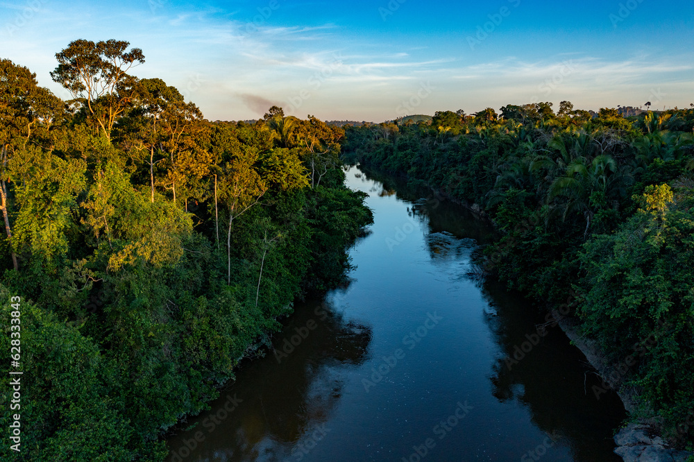sunset over the small river on Amazon rainforest sunset over the small river on Amazon rainforest