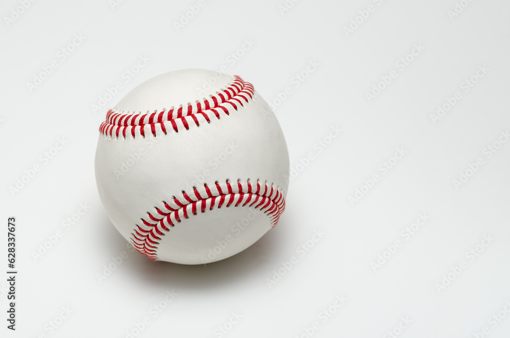 Closeup of a baseball ball with red stitches