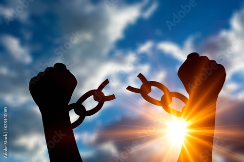 Fototapeta Person raises hands with steel chains