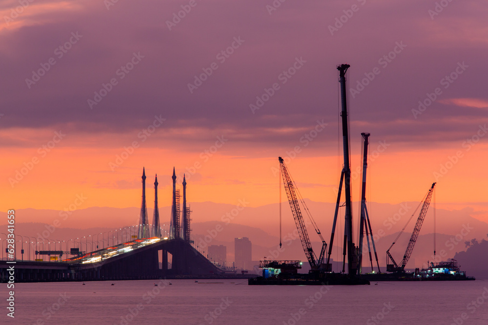 Construction of monopole transmission tower beside Penang Bridge in Penang, Malaysia by Tenaga National Berhad. Electrical company construction mega project.