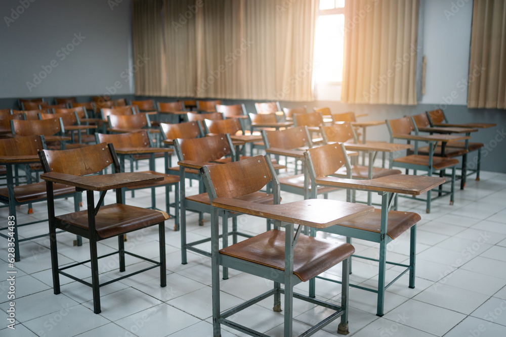 Empty classroom with vintage tone wooden chairs. Back to school concept