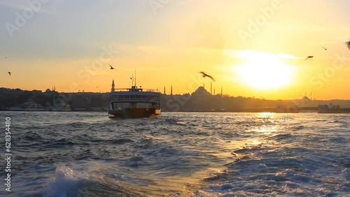 Ship following seagulls on sunset. Atmosphere at sunset is one of the most relaxed you will ever experience in Istanbul. Cruising out from the city
 photo