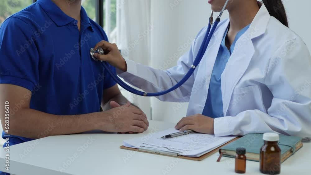 Unknown woman doctor filling up an application form while consulting patient. Medicine concept Unknown woman doctor filling up an application form while consulting patient. Medicine concept