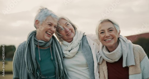 Comedy, laughing and senior woman friends outdoor in a park together for bonding during retirement. Portrait, smile and funny with a happy group of elderly people bonding in a garden for humor or fun photo