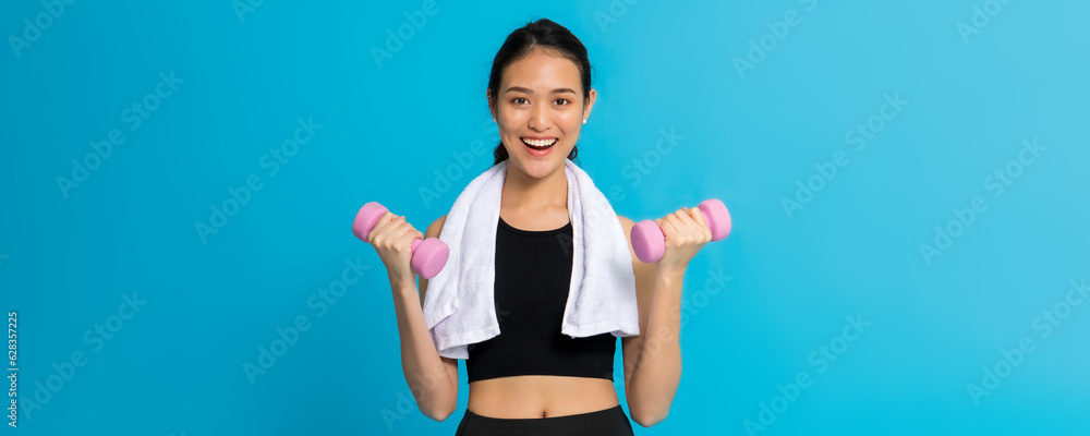 Asian beautiful happy woman exercise with dumbbell isolated on blue color background.Concept of healthy girl workout. Asian beautiful happy woman exercise with dumbbell isolated on blue color background.Concept of healthy girl workout.