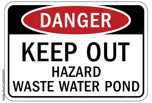 Sewage water warning sign and labels keep out hazard waste water pond