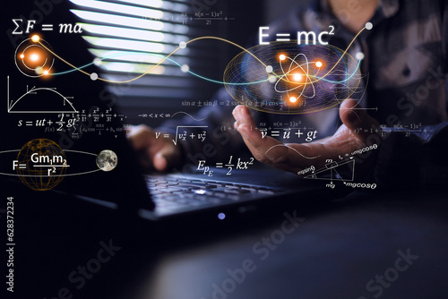 student holding physics and math equations it floating from the laptop computer screen, representing the learning teaching or scientific theory of Albert Einstein and Sir Isaac Newton.