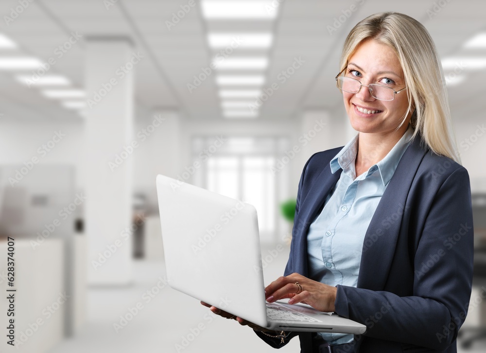 Portrait of a young happy office woman hold laptop Portrait of a young happy office woman hold laptop