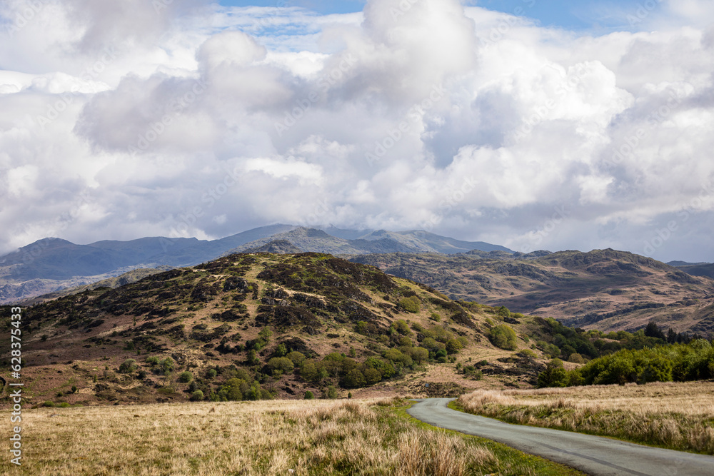 The road home through Thwaites fell in the lake district Cumbria north east England UK The road home through Thwaites fell in the lake district Cumbria north east England UK